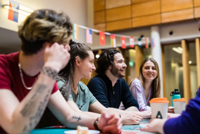 A group of students chatting in the canteen