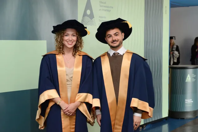 Two doctorate graduands at Conferring