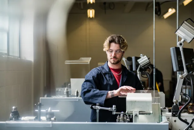 A student is working on some heavy machinery