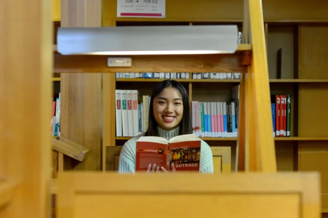 A student reading in the library