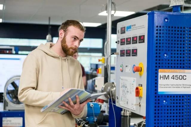 A student checking equipment