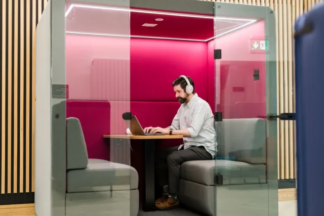 A student studying in a booth