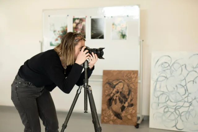 Student taking photos in YAADA building