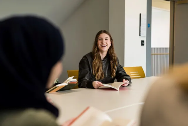 Student laughing in Writing and Literature classroom