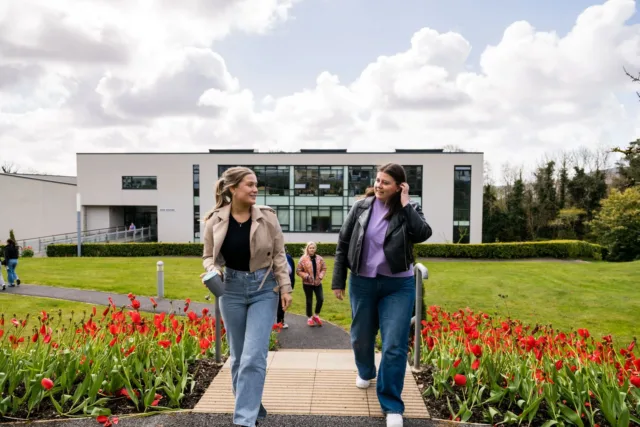 External shot of students talking