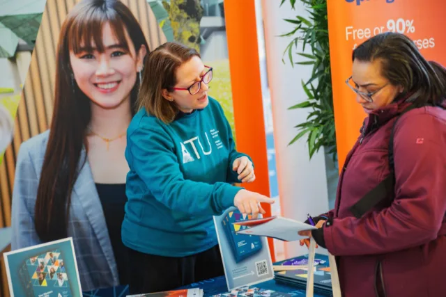 ATU Staff member showing a prospective student information from a Springboard Quick Guide