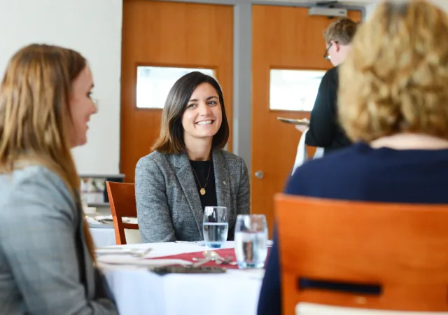 Professional women sits at table during business lunch