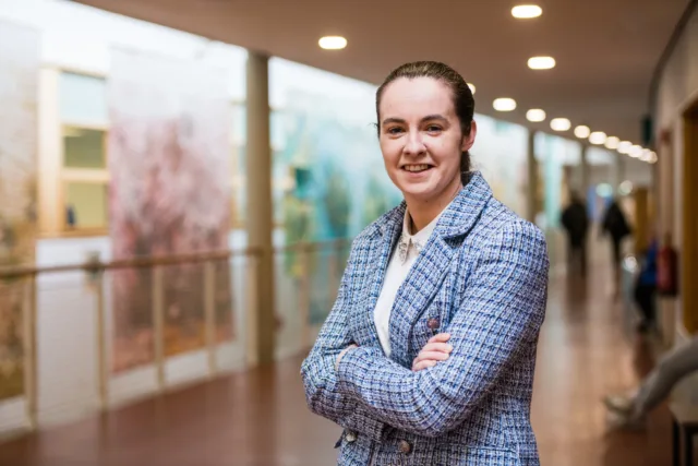 Chantelle Grant, Graduate of the MBs in Innovation and Leadership standing arms crossed in ATU Donegal Letterkenny Campus