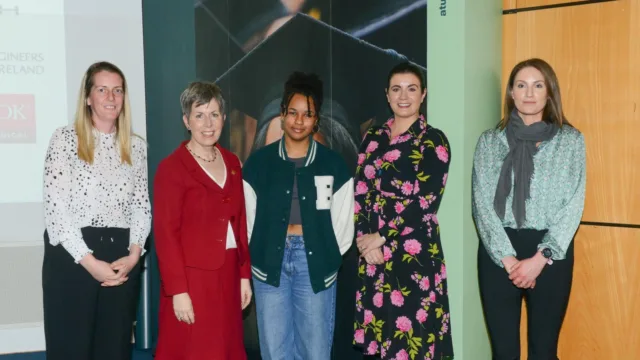 Five professionals standing in a line, smiling for the camera. Left to right: Iseult Mangan from Teen-Turn, Dr. Orla Flynn from ATU, Rebecca Dara, a first-year Mechanical Engineering student and scholarship recipient, and two HR leaders from TRANE Technologies, Gail Quinn and Isobel Foyle.