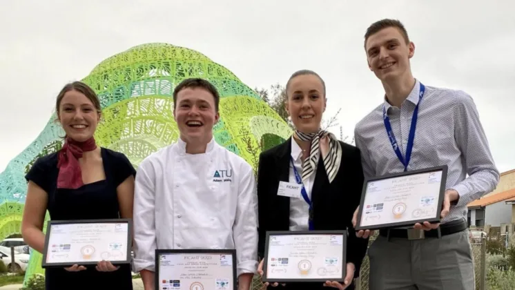 The winning team from ATU Ireland and Lycée Christian Bourquin, pictured from left to right: Emma Ryan, Adam Walsh, Juliette Grell, and Alexis Wiart. They are all smiling at the camera, holding framed certificates.