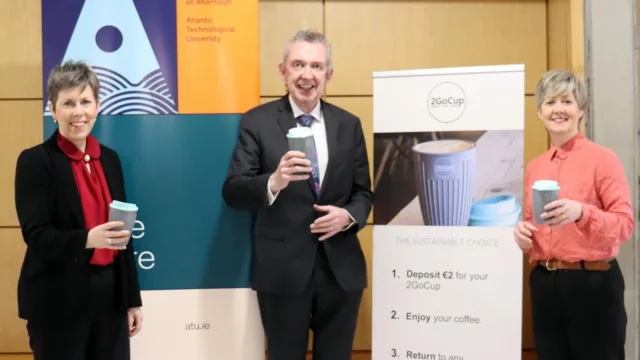 Three people smile for the camera, holding up their reusable coffee cups. From left to right: Dr. Orla Flynn, ATU President; Paul Hannigan, Head of College ATU Donegal; and Gillian Cullen, Canteen Manager at ATU Donegal.