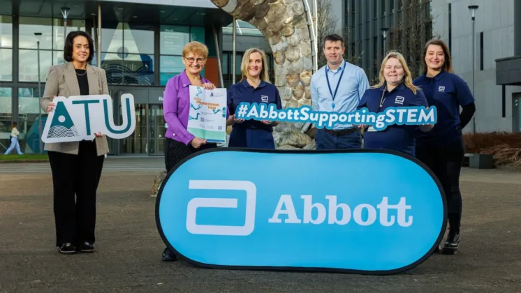 ATU staff holding ABBOT and ATU signs