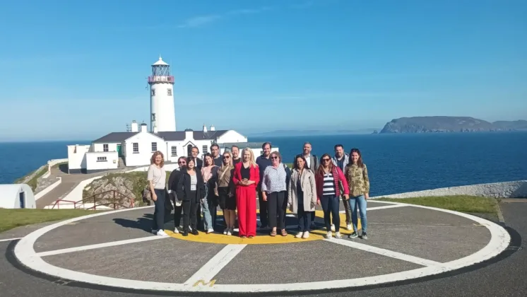 ATU and Donegal County Council welcome international partners In front of lighthouse