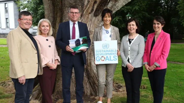 ATU Mayo and Mayo County council staff pose outside beside tree