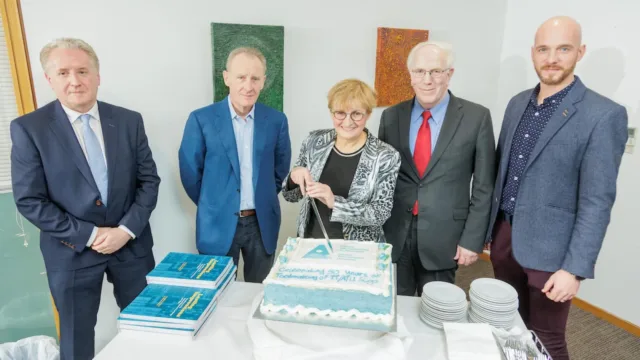 ATU staff cut cake celebrating 50 years of toolmaking at ATU