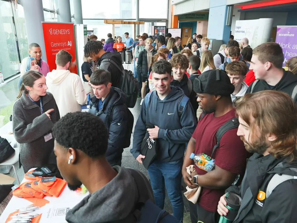 group of people visit stalls at ATU careers Fair Galway campus