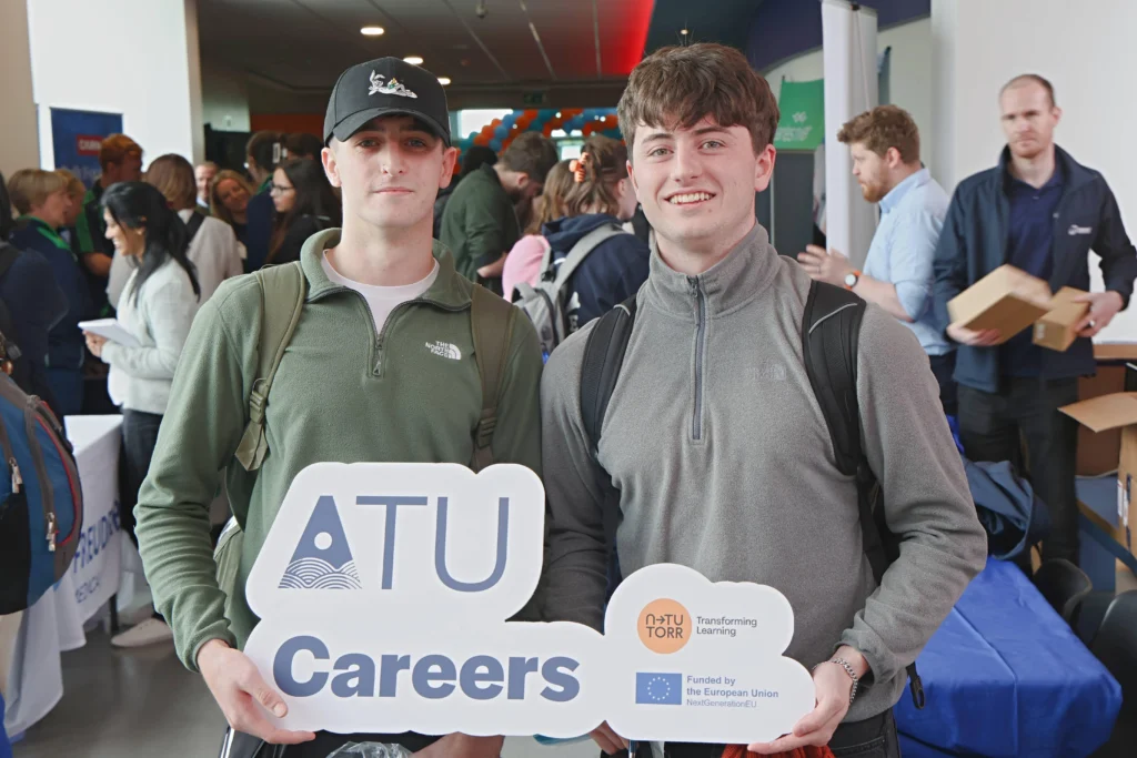 2 students holding atu careers sign at ATU careers fair Galway campus