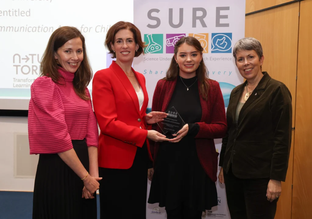 atu graduate receiving award at SURE conference