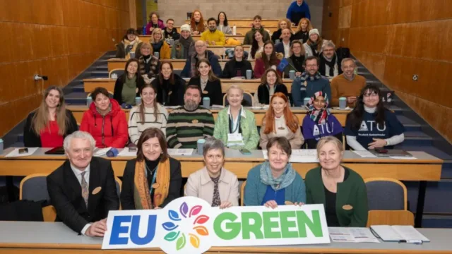 ATU Staff hold EU Green sign in Lecture theatre