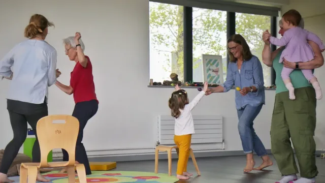 Older people and toddlers dancing