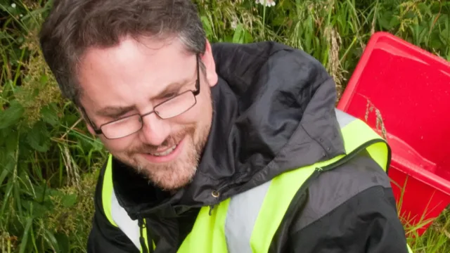 man holds shrew