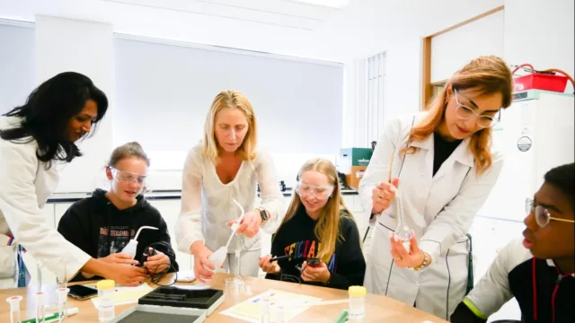 individuals inspecting lab equipment