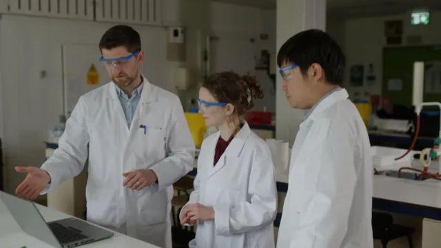 Scientists in a lab having a conversation