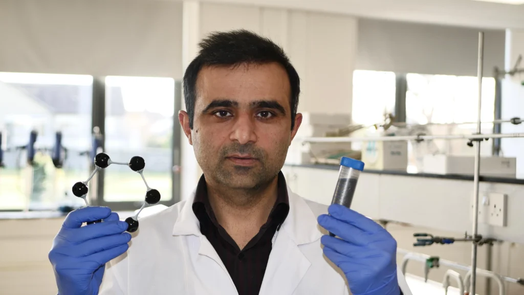 Scientist wearing blue gloves holding scientific equipment