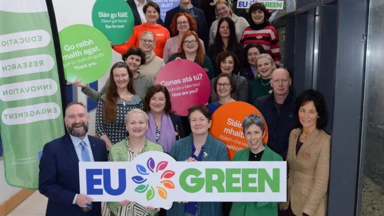 Group stand with EU Green sign