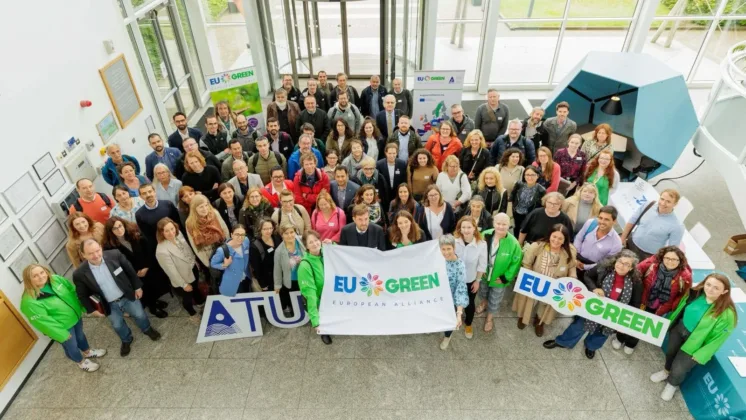 EU GREEN Alliance-crowd pose with EU green banner