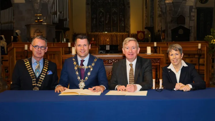 The Mayor of the City of Galway and the President of the Galway Chamber, both wearing chains of office, are pictured sitting together with the Presidents from University of Galway and Atlantic Technological University (Galway) to announce and sign the Greater Galway Charter.