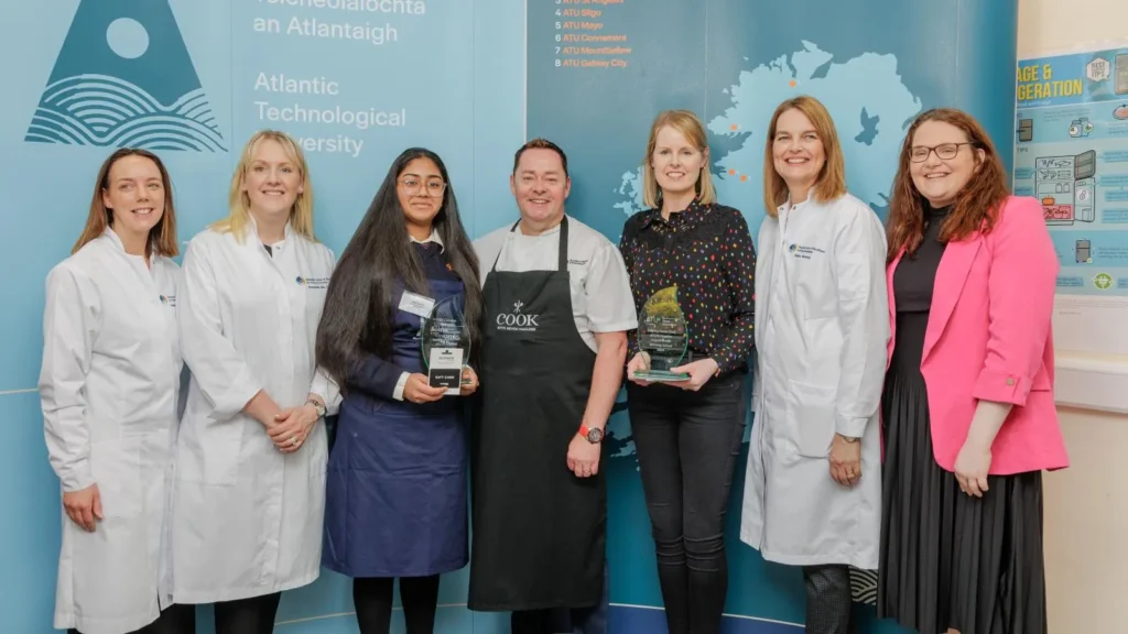 Chefs and student receiving an award