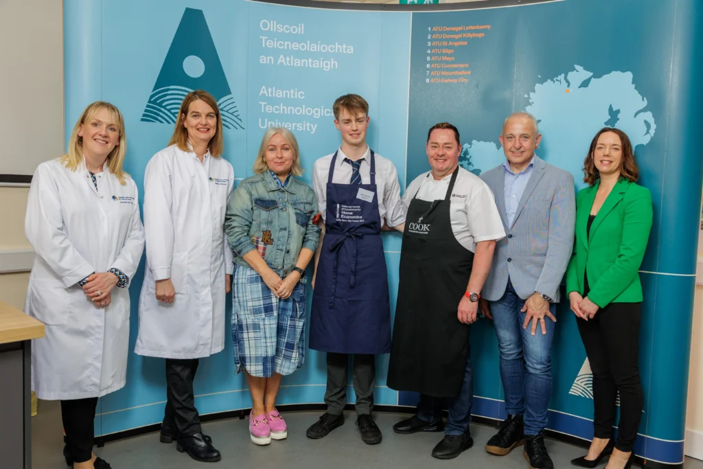 Chefs and student receiving an award