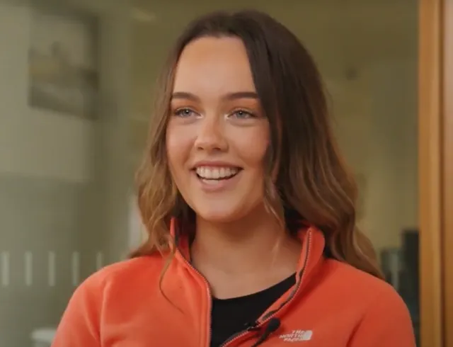 Female student in Orange jumper