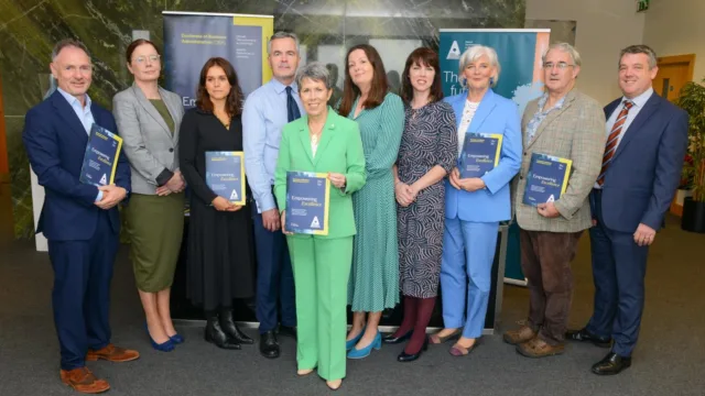 A group of ATU staff and guests at the launch of the new Doctorate of Business Administration (DBA), offering the highest level of management qualification. ATU President Dr. Orla Flynn is pictured in the center, wearing a green suit and holding up the new brochure.