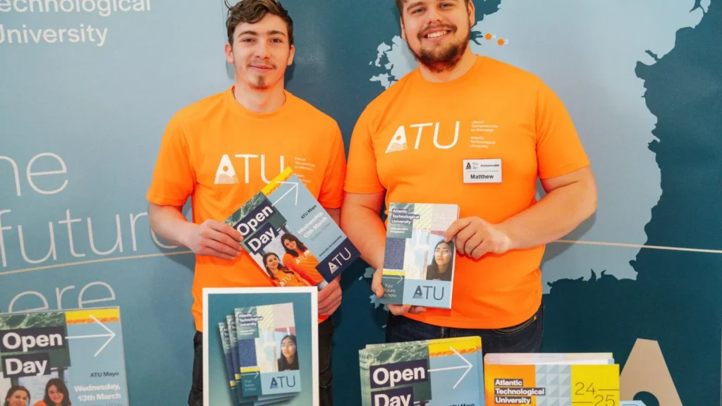 Two male students in orange ATU t-shirts