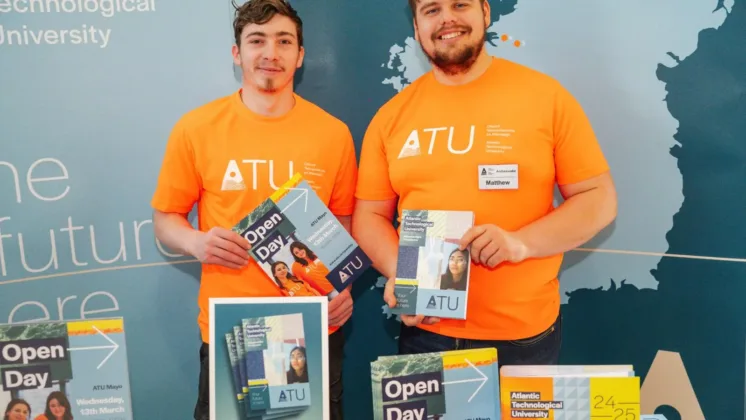 Two male students in orange ATU t-shirts