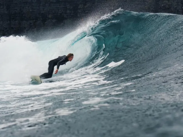 Surfer riding the waves