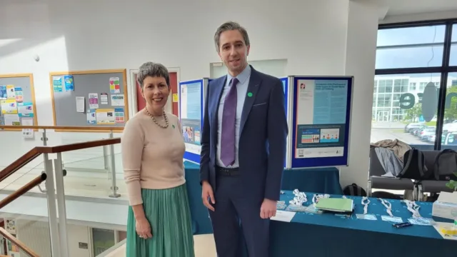 ATU President Dr Orla Flynn and Minister Simon Harris, TD smile for the camera.