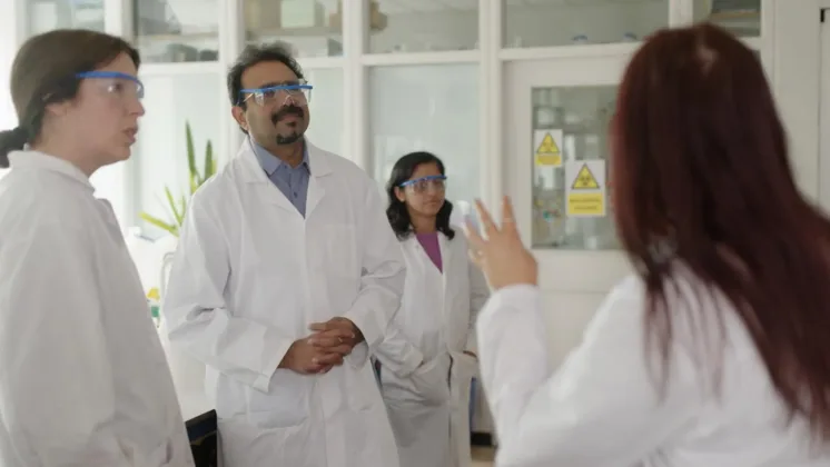 group of 4 scientists having a discussion