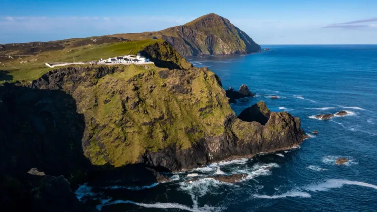 The Clare Island Lighthouse located on Clare Island, Co. Mayo, overlooking the surrounding waters.