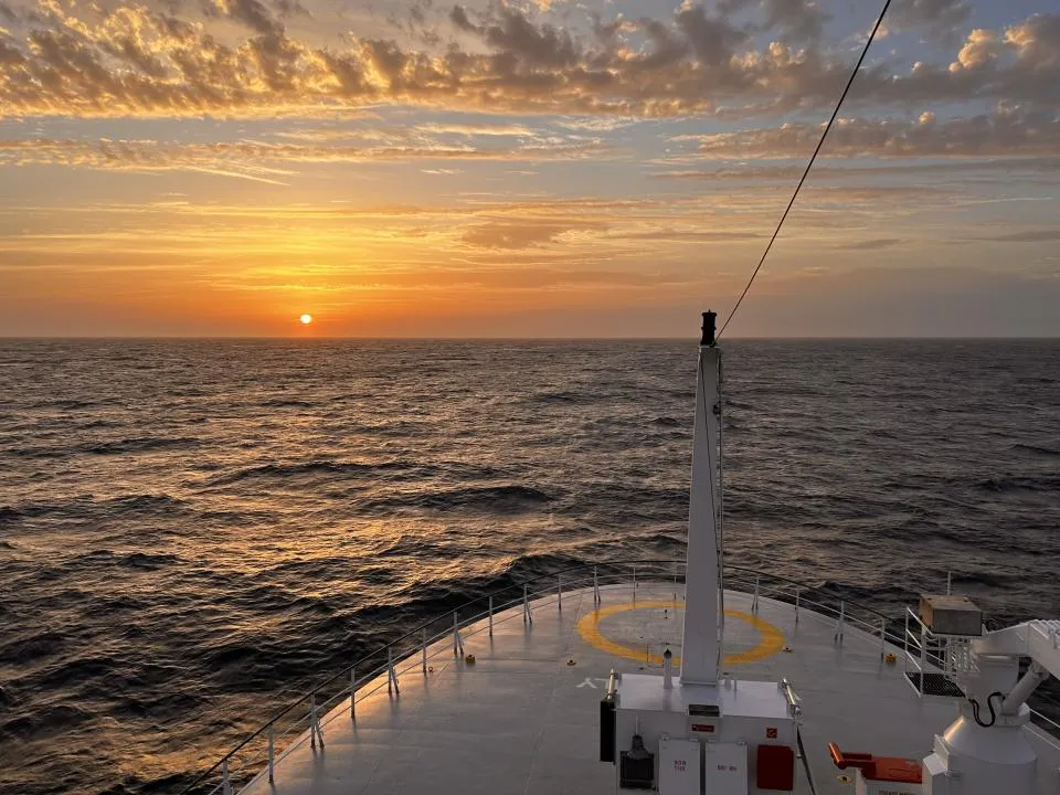 sunset on  boat looking with the ocean in the background