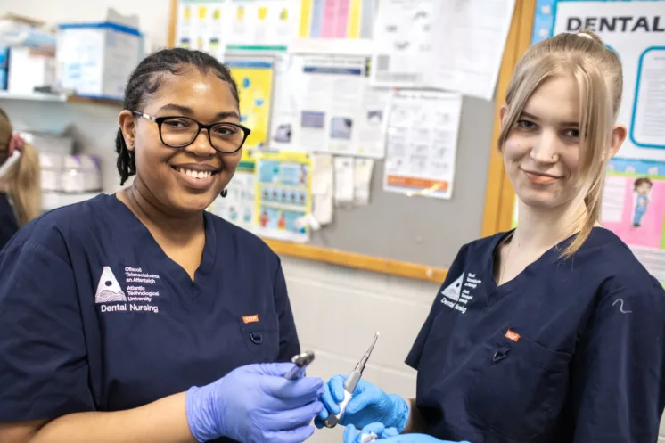 Two nursing students smiling at camera