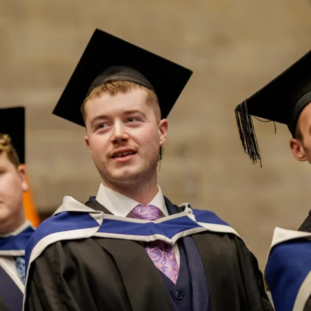 ATU student Paul in graduation gown