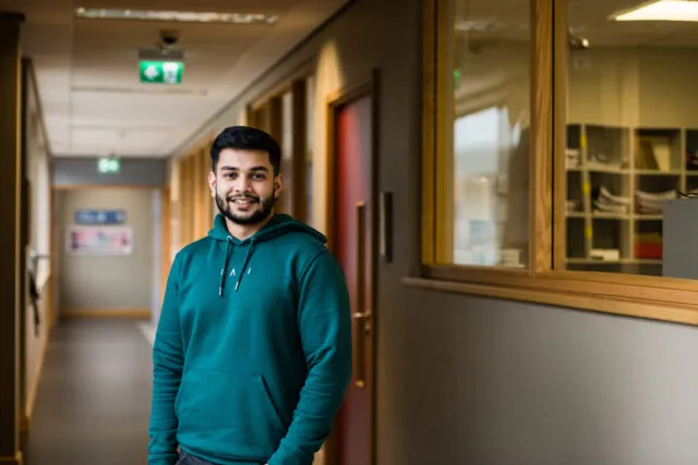 Male international student stand in corridor on the Letterkenny campus