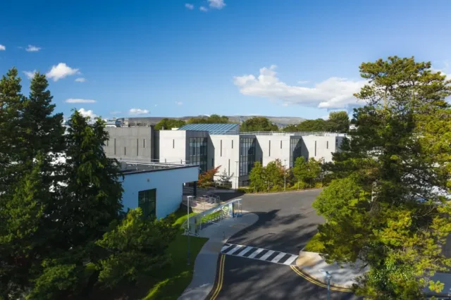 ATU campus image of trees and white buildings