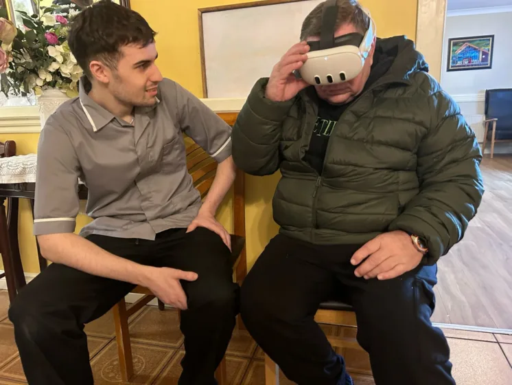 A resident exploring the VR technology at Hillview Nursing Home, Letterkenny