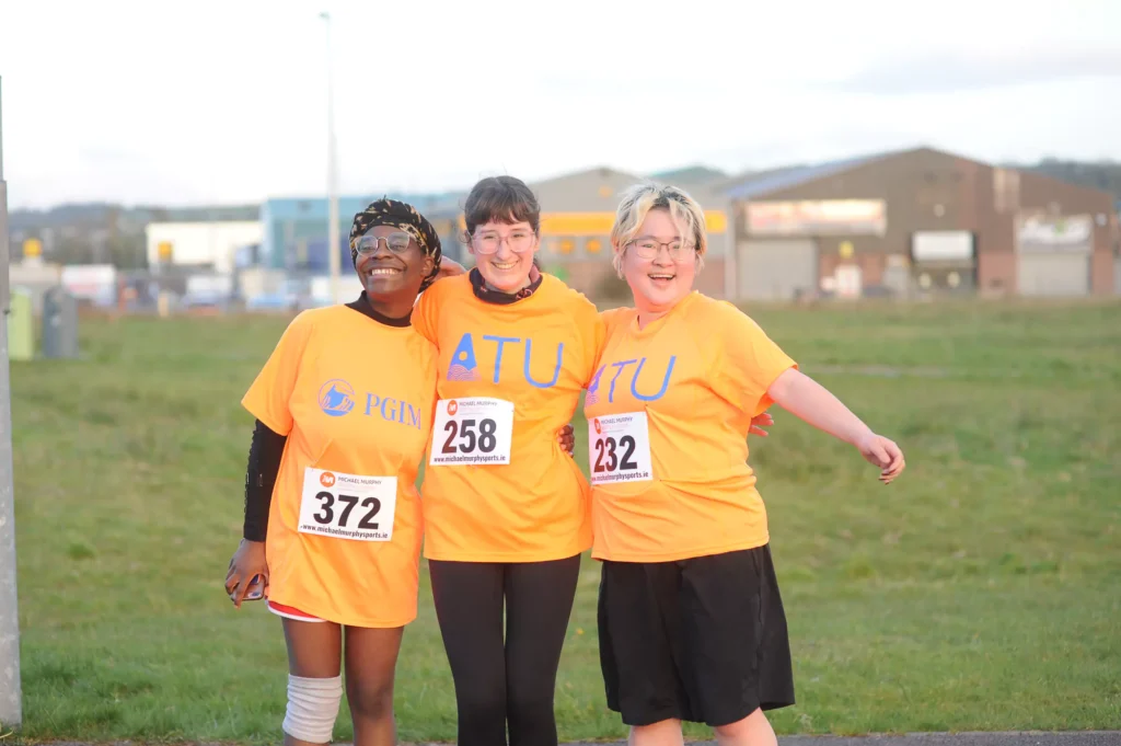 3 runners in orange t-shirts